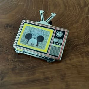 Walt Disney World pin traders, holographic TV set, three images of Mickey Mouse.